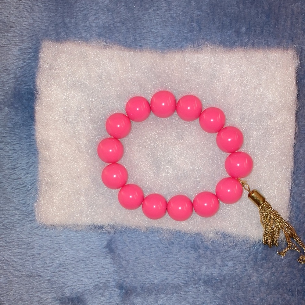 NEW- Price drop-Fuchsia stretch bracelet with tassels
